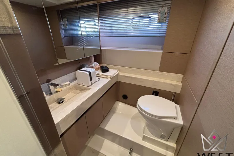 Albina Yacht Photos Pics Luxurious bathroom in 2018 Prestige 520 yacht with modern fixtures and sleek design.