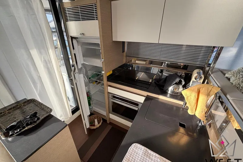 Albina Yacht Photos Pics Modern kitchen in 2018 Prestige 520 yacht with open fridge and sleek appliances.