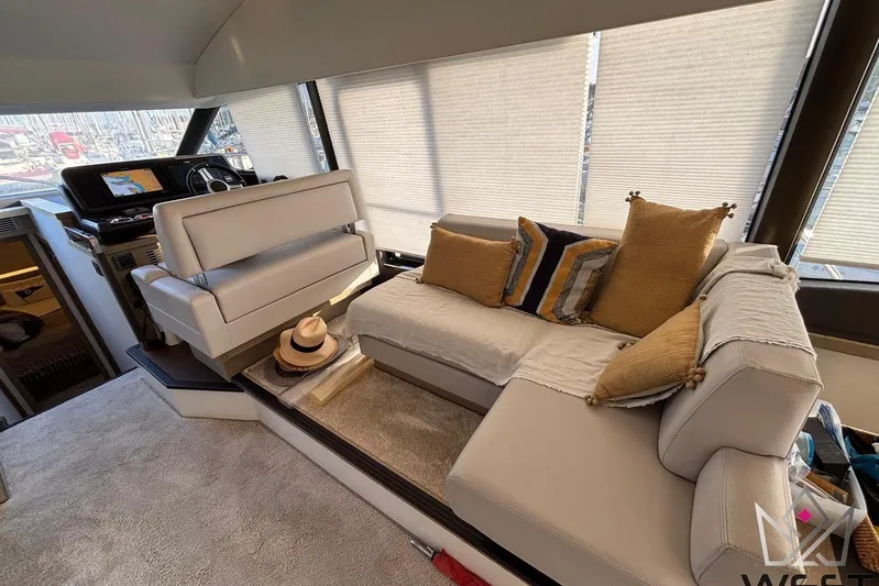 Albina Yacht Photos Pics Luxurious interior of 2018 Prestige 520 yacht with plush seating and helm station.