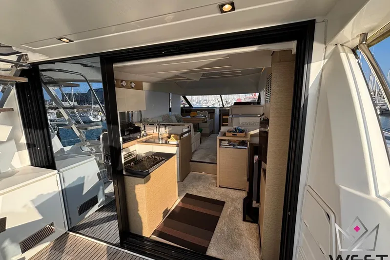 Albina Yacht Photos Pics Luxurious interior of 2018 Prestige 520 yacht with modern kitchen and spacious seating area.