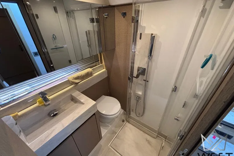 Albina Yacht Photos Pics Luxurious bathroom in 2018 Prestige 520 yacht with modern fixtures and glass shower.