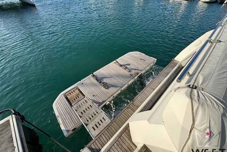 Albina Yacht Photos Pics Luxury yacht Prestige 520, 2018 model, with hydraulic swim platform in marina.