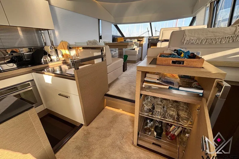 Albina Yacht Photos Pics Luxurious interior of a 2018 Prestige 520 yacht with modern kitchen and lounge area.