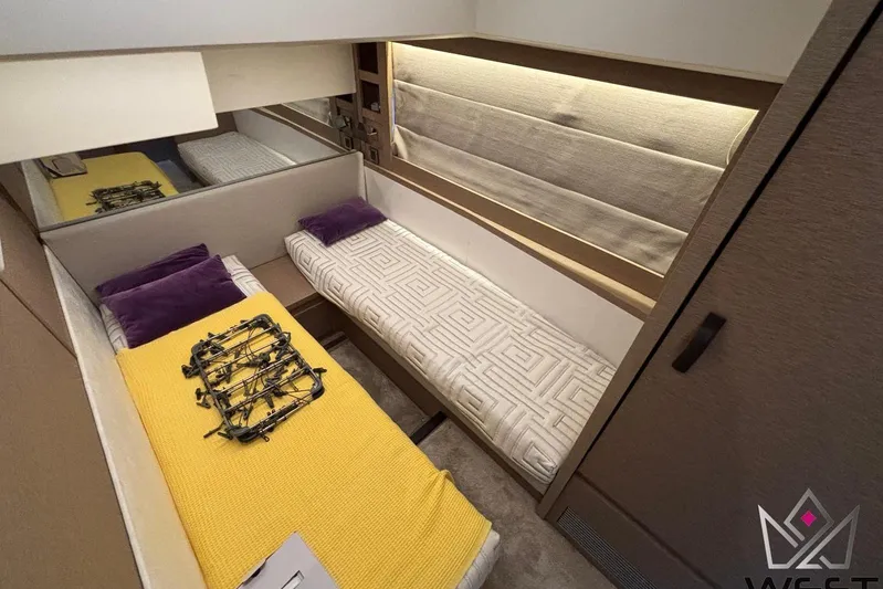 Albina Yacht Photos Pics Twin cabin interior of 2018 Prestige 520 yacht with modern decor and cozy bedding.