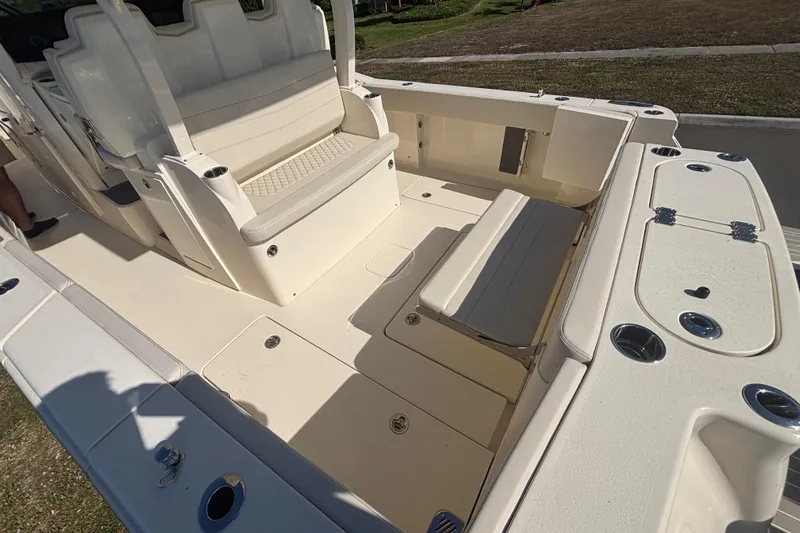  Yacht Photos Pics 2026 Scout 357 LXF boat interior with seating and storage compartments.