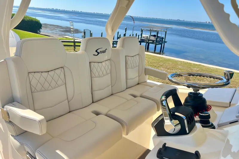  Yacht Photos Pics Luxurious interior of 2026 Scout 357 LXF boat with plush seating and scenic waterfront view.