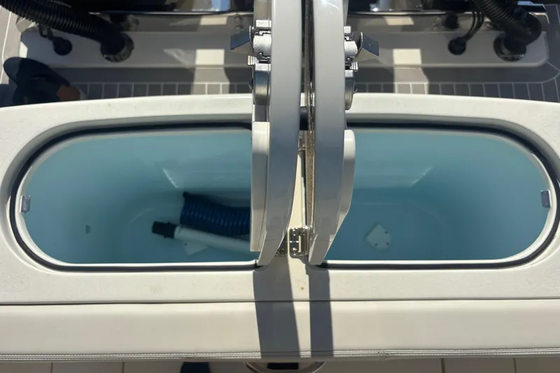  Yacht Photos Pics Open storage compartments on a 2026 Scout 357 LXF boat deck.