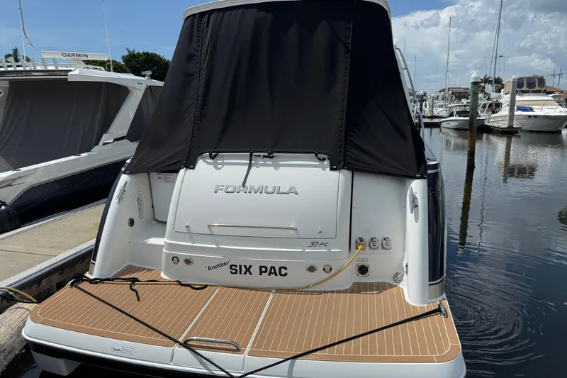 Another Six Pack Yacht Photos Pics 2016 Formula 37 Performance Cruiser docked at marina, rear view with black cover.