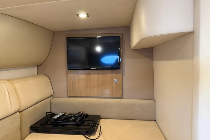 Another Six Pack Yacht Photos Pics Interior of 2016 Formula 37 Performance Cruiser with TV and beige seating.