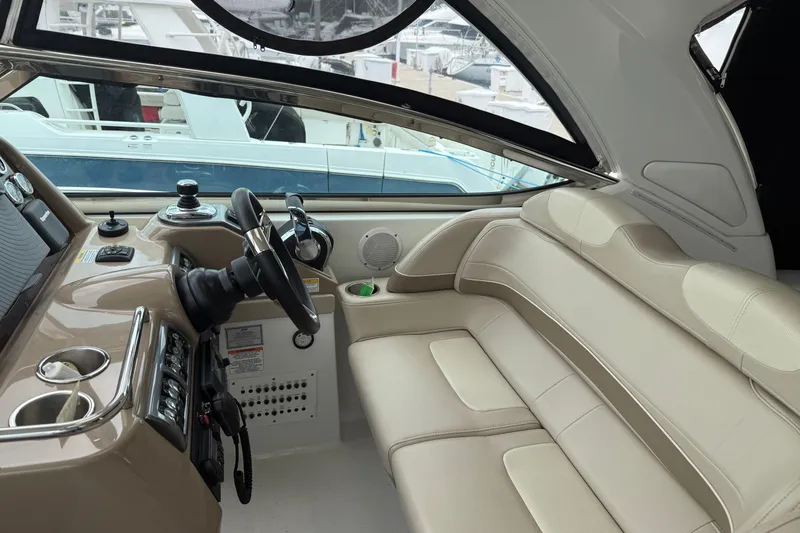 Another Six Pack Yacht Photos Pics 2016 Formula 37 Performance Cruiser interior with beige seating and modern dashboard.