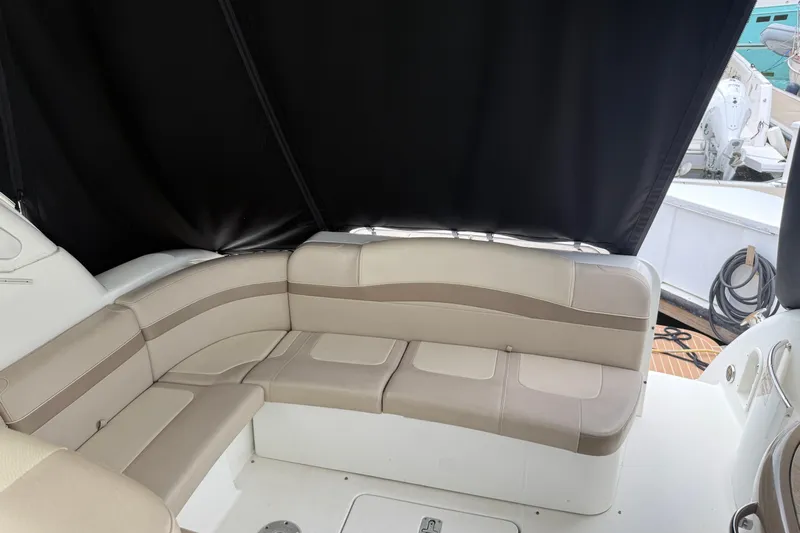 Another Six Pack Yacht Photos Pics 2016 Formula 37 Performance Cruiser interior with beige seating and black canopy.