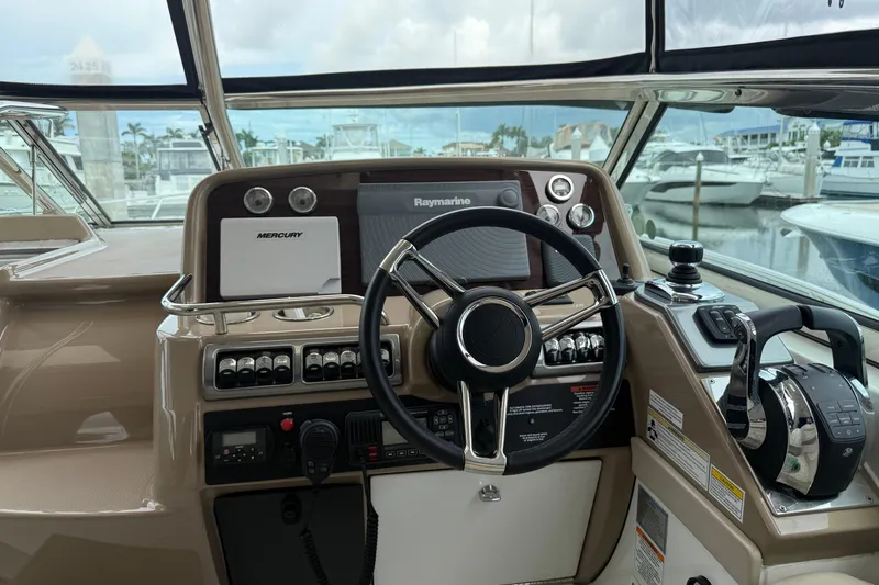 Another Six Pack Yacht Photos Pics Helm of 2016 Formula 37 Performance Cruiser with navigation controls and steering wheel.