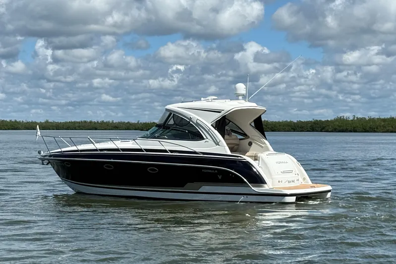 Another Six Pack Yacht Photos Pics 2016 Formula 37 Performance Cruiser on calm water under cloudy sky.