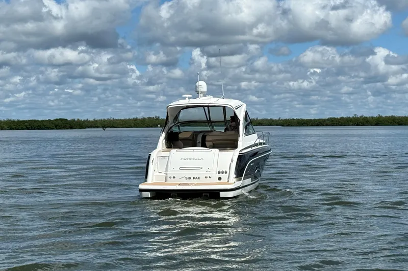 Another Six Pack Yacht Photos Pics 2016 Formula 37 Performance Cruiser on calm water under cloudy sky.