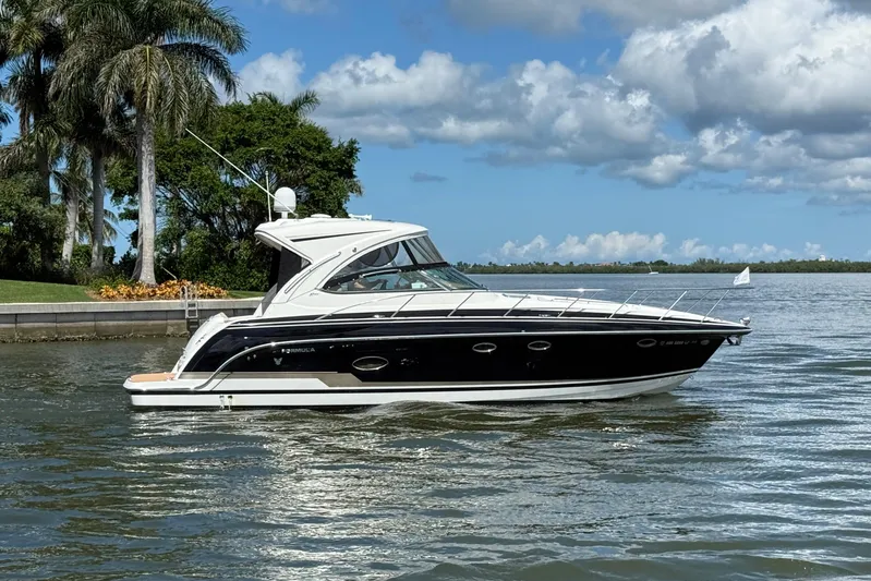 Another Six Pack Yacht Photos Pics 2016 Formula 37 Performance Cruiser on a scenic waterway with palm trees.