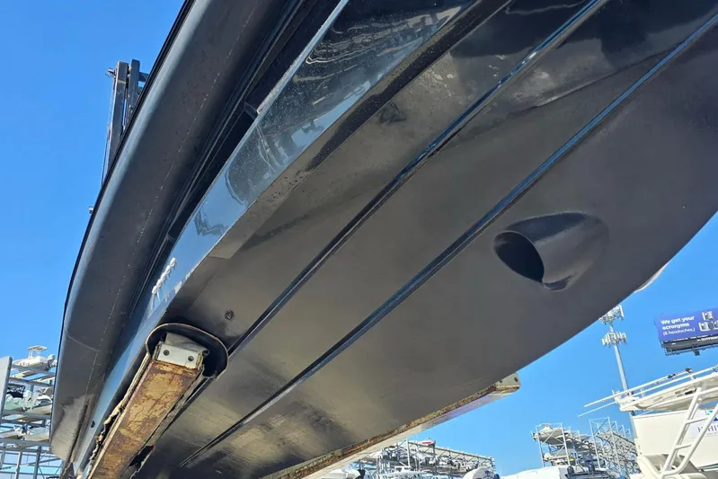 B-offline Yacht Photos Pics Underneath view of a 2019 SACS Rebel 40 boat hull against a clear blue sky.