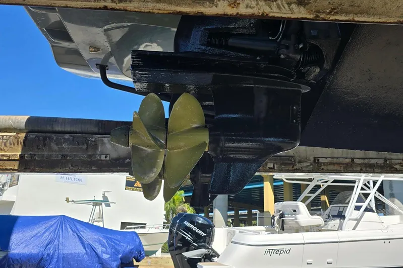 B-offline Yacht Photos Pics Propeller of 2019 SACS Rebel 40 boat, docked with other vessels in the background.