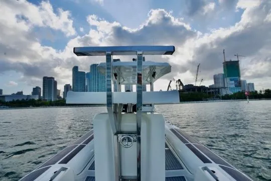  Yacht Photos Pics 2022 Brig Eagle 10 boat on water with city skyline in background.