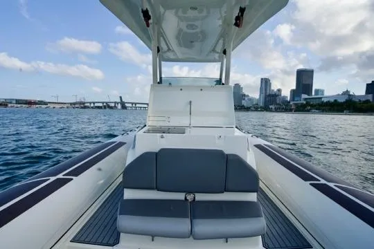  Yacht Photos Pics 2022 Brig Eagle 10 boat on water with city skyline in background.