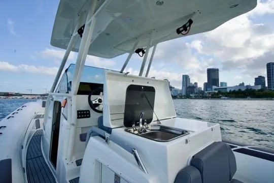  Yacht Photos Pics 2022 Brig Eagle 10 boat with city skyline in the background.