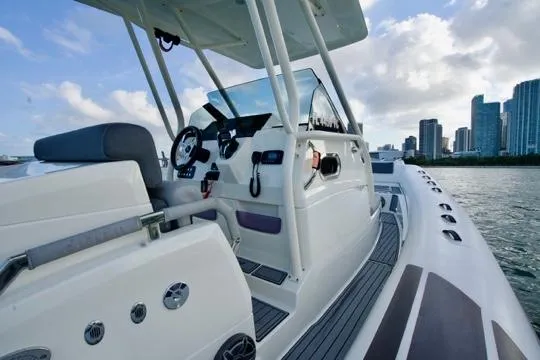  Yacht Photos Pics 2022 Brig Eagle 10 boat interior with city skyline in background.