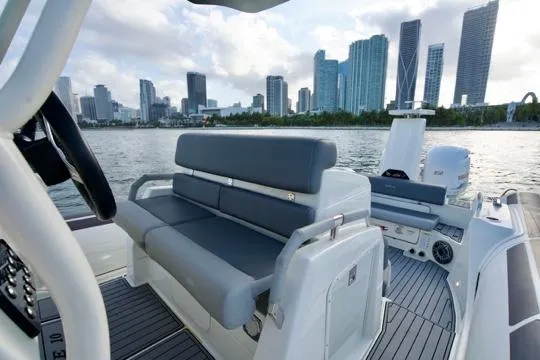  Yacht Photos Pics 2022 Brig Eagle 10 boat interior with city skyline in the background.