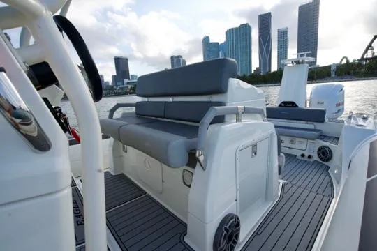  Yacht Photos Pics 2022 Brig Eagle 10 boat interior with city skyline in background.