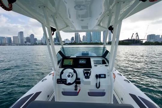  Yacht Photos Pics 2022 Brig Eagle 10 boat dashboard with city skyline in the background.