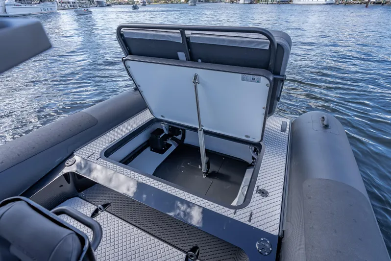  Yacht Photos Pics 2024 Goldfish X10 Scout boat with open storage compartment on the water.