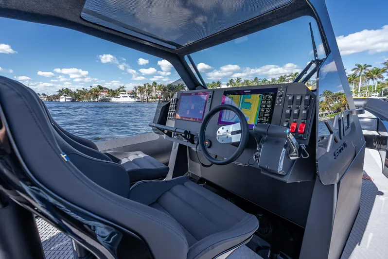  Yacht Photos Pics 2024 Goldfish X10 Scout boat cockpit with advanced navigation system and dual seats.