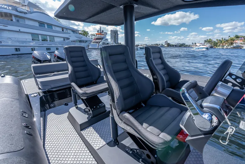  Yacht Photos Pics Interior of 2024 Goldfish X10 Scout boat with luxury seating and waterfront view.