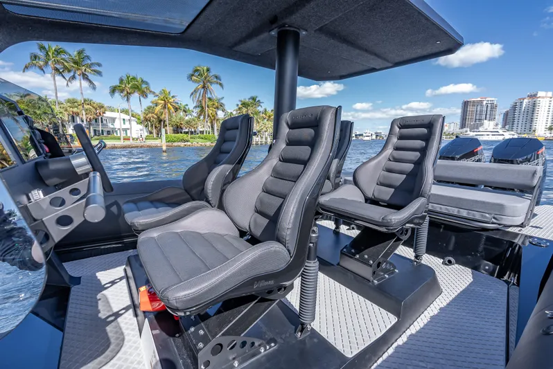  Yacht Photos Pics Interior seating of 2024 Goldfish X10 Scout boat with waterfront view.