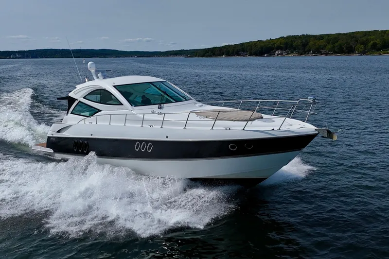  Yacht Photos Pics 2012 Cruisers Yachts 540 Sports Coupe cruising on open water.