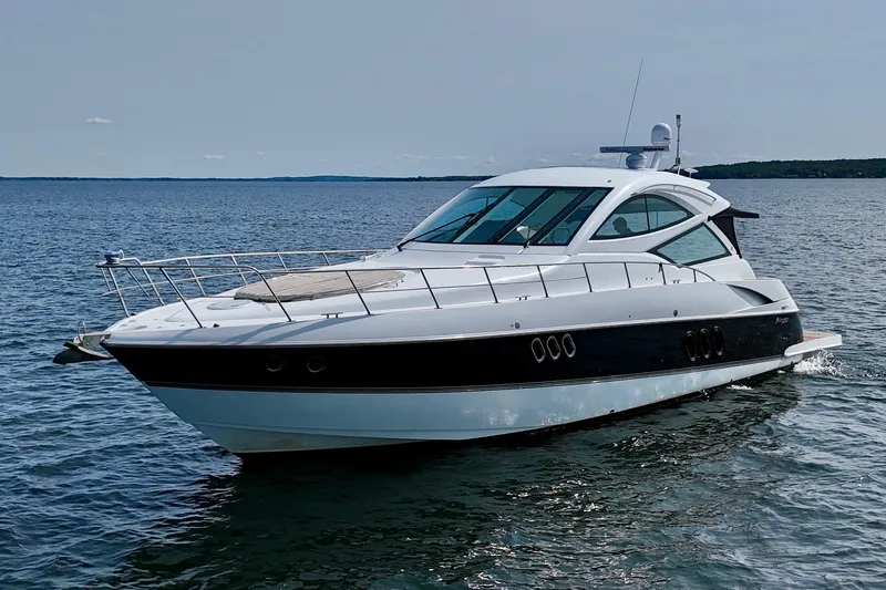  Yacht Photos Pics 2012 Cruisers Yachts 540 Sports Coupe on open water, sleek design, luxury motor yacht.