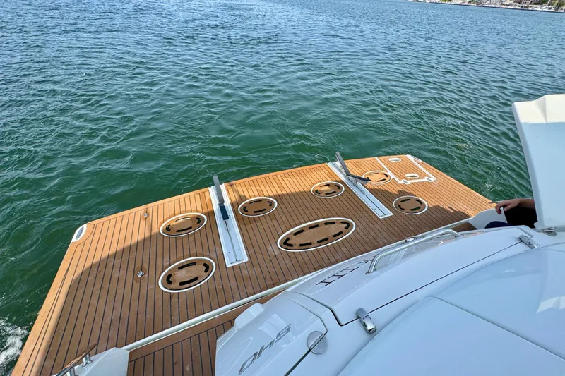  Yacht Photos Pics 2012 Cruisers Yachts 540 Sports Coupe deck overlooking calm blue water.