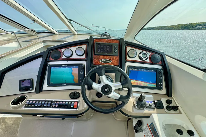  Yacht Photos Pics Helm of 2012 Cruisers Yachts 540 Sports Coupe with advanced navigation systems.