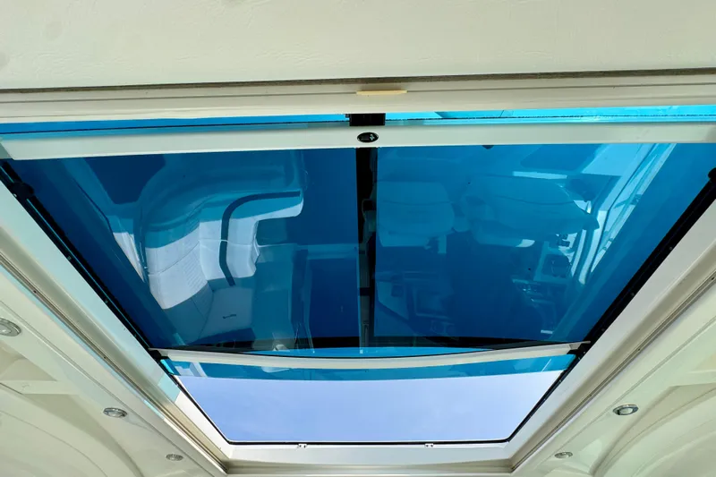  Yacht Photos Pics 2012 Cruisers Yachts 540 Sports Coupe sunroof with blue-tinted glass, interior view.