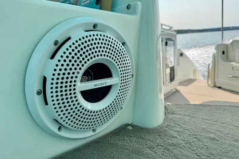  Yacht Photos Pics Sony speaker on 2012 Cruisers Yachts 540 Sports Coupe, overlooking serene water view.