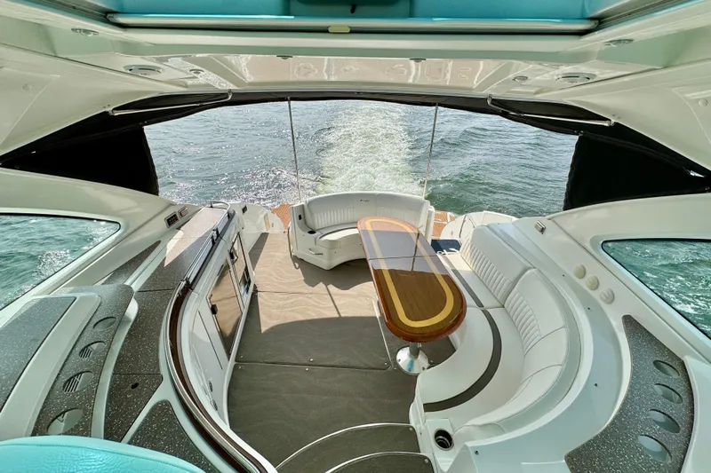  Yacht Photos Pics Luxurious 2012 Cruisers Yachts 540 Sports Coupe interior with elegant seating and ocean view.