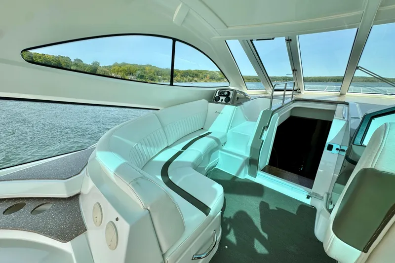  Yacht Photos Pics Interior of 2012 Cruisers Yachts 540 Sports Coupe with panoramic windows and plush seating.