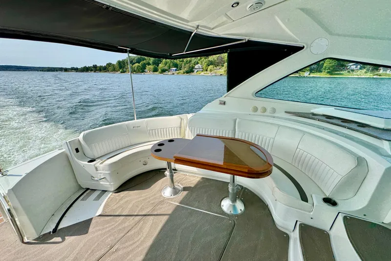  Yacht Photos Pics 2012 Cruisers Yachts 540 Sports Coupe interior with elegant seating and scenic water view.