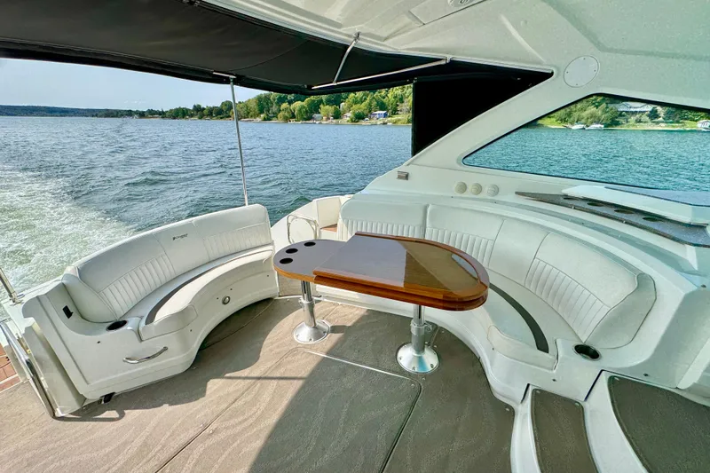  Yacht Photos Pics Luxurious 2012 Cruisers Yachts 540 Sports Coupe interior with elegant seating and scenic water view.