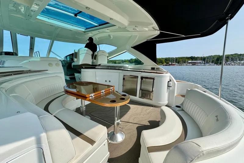  Yacht Photos Pics Luxurious 2012 Cruisers Yachts 540 Sports Coupe interior with elegant seating and scenic water view.