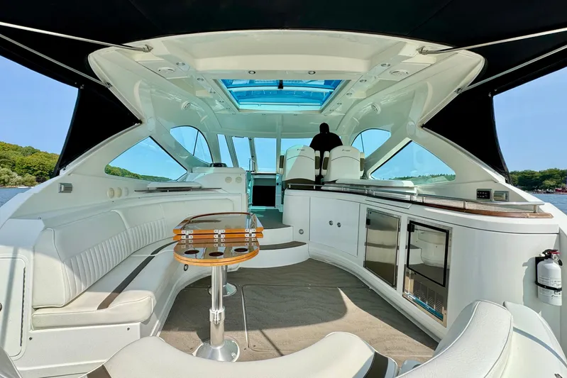  Yacht Photos Pics Luxurious interior of 2012 Cruisers Yachts 540 Sports Coupe with modern amenities and seating.
