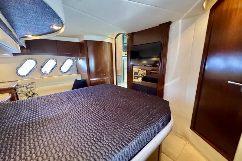  Yacht Photos Pics Luxurious interior of 2012 Cruisers Yachts 540 Sports Coupe with elegant wood finishes.