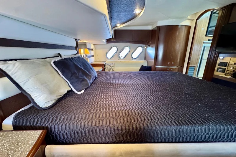  Yacht Photos Pics Luxurious bedroom interior of 2012 Cruisers Yachts 540 Sports Coupe with elegant bedding.