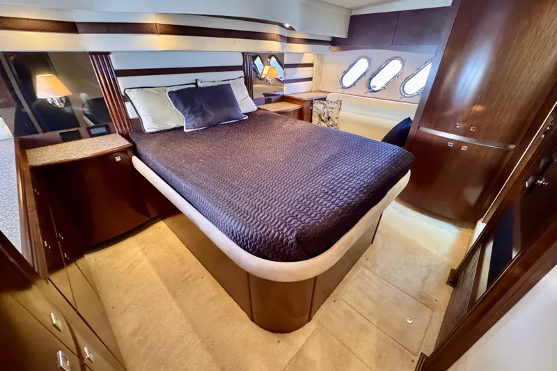  Yacht Photos Pics Luxurious cabin interior of 2012 Cruisers Yachts 540 Sports Coupe with elegant bedding.