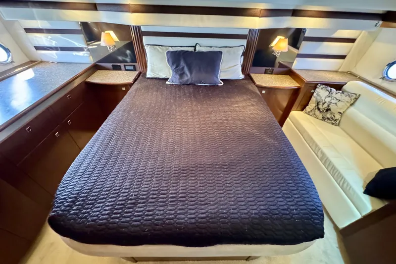  Yacht Photos Pics Luxurious bedroom interior of 2012 Cruisers Yachts 540 Sports Coupe with elegant bedding.