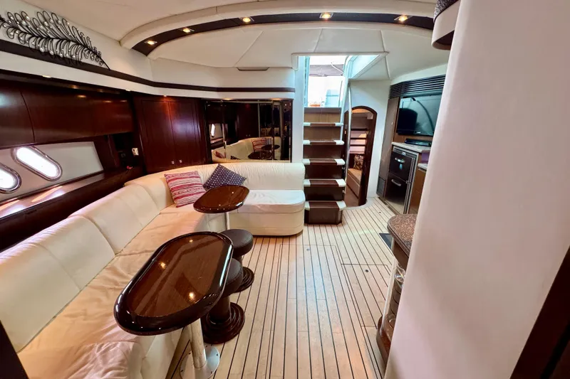  Yacht Photos Pics Luxurious interior of 2012 Cruisers Yachts 540 Sports Coupe with elegant seating and modern amenities.