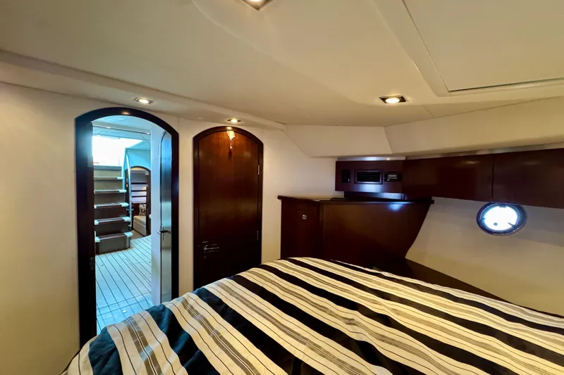  Yacht Photos Pics Luxurious interior of 2012 Cruisers Yachts 540 Sports Coupe with elegant wood finishes.